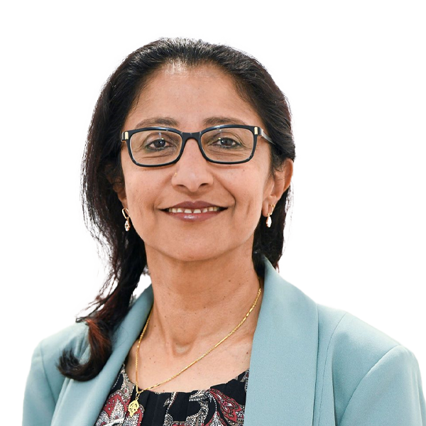 Professional headshot of female healthcare practitioner wearing glasses and light blue cardigan