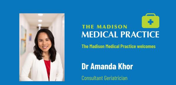 Dr Amanda Khor, Consultant Geriatrician at The Madison Medical Practice, smiling in clinical corridor
