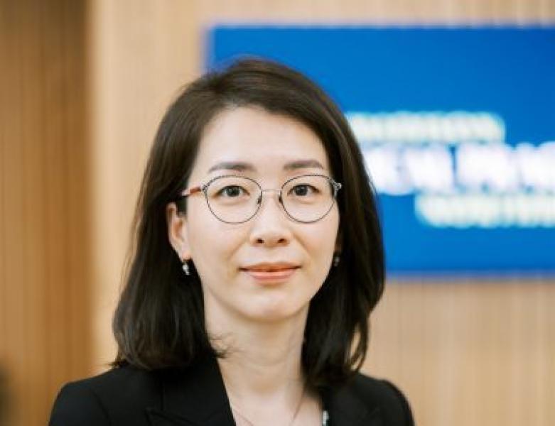 Professional female doctor wearing glasses in modern medical practice setting